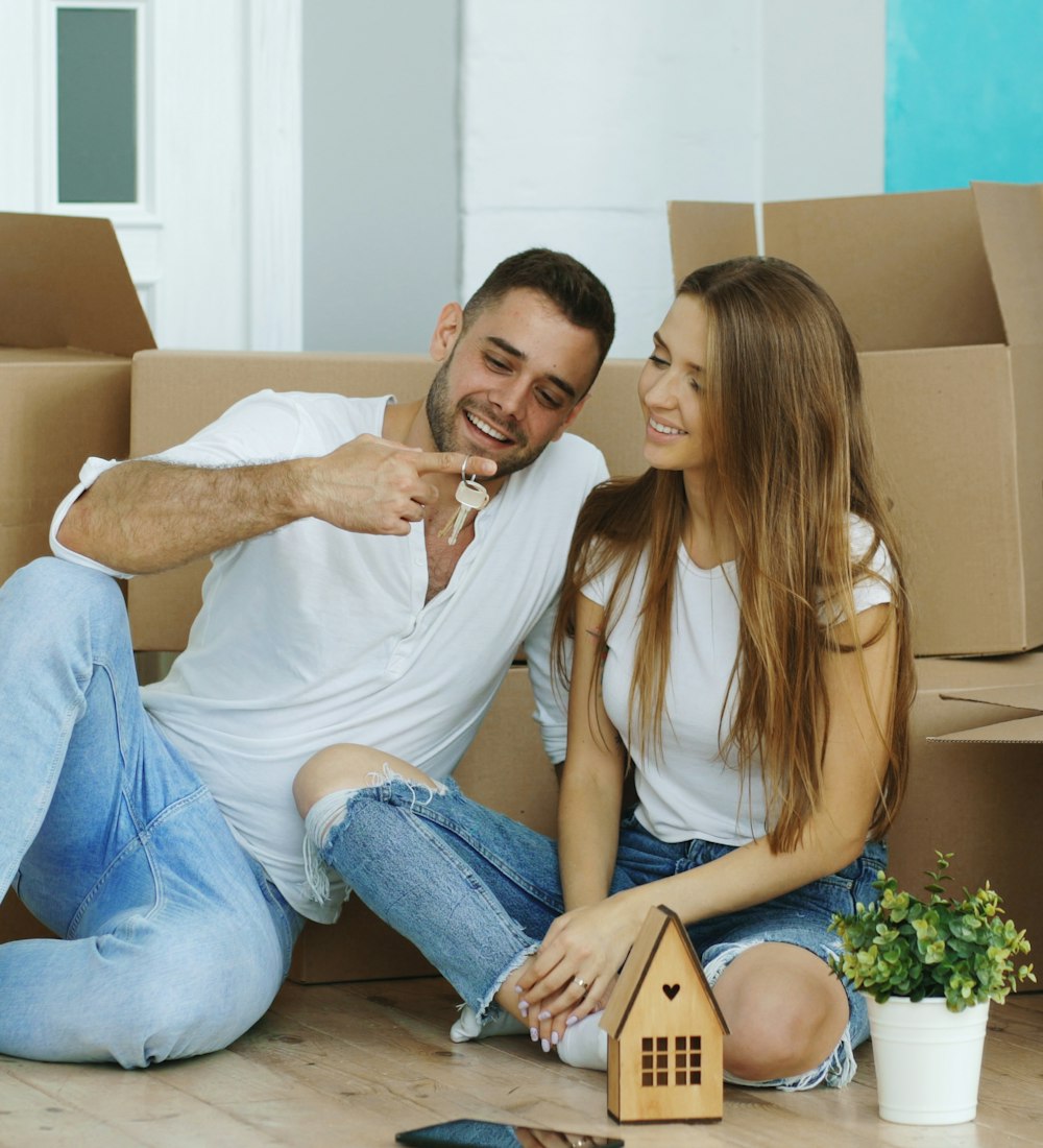 Family unpacking boxes in their new home